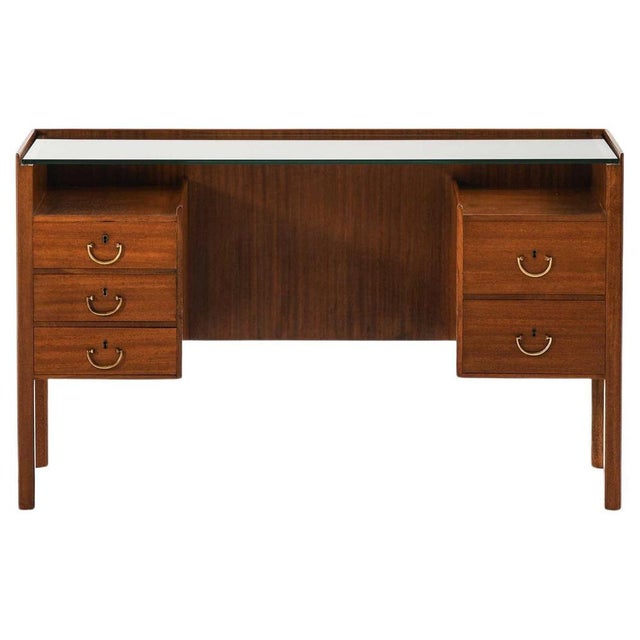 This very rare dressing table or desk, designed by josef frank and produced by svenskt tenn in sweden, is a refined and...