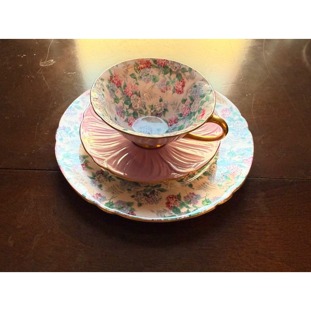 This stunning 3-piece porcelain tea trio was crafted in England by the renowned Shelley Fine Bone China pottery. The set...