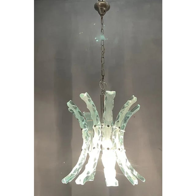 Zero Quattro Chandelier Composed of 9 hand crafted glass pieces on a chrome frame Height without chain and ceiling canopy...