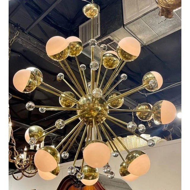 Exquisite large scale modern brass and pink and clear Murano glass sputnik chandelier. A very beautiful chandelier that is...
