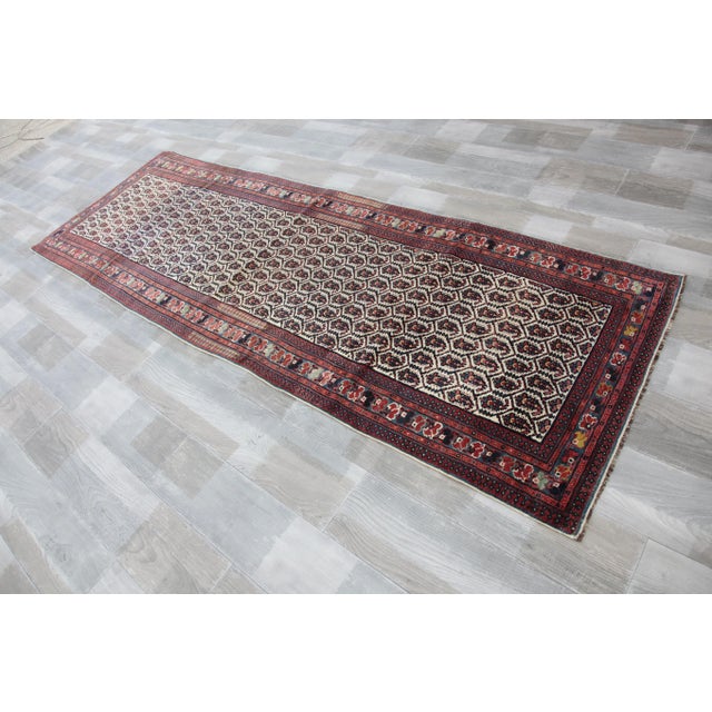 This listing is for an exceptional Antique Collector handknotted Sahsavan Runner rug. i can say the wool is very soft it...