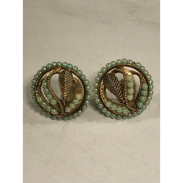 These lovely 1940s Petit Point Pearl and Gold Earrings will be such a unique and beautiful pair of clip-on earrings to add...