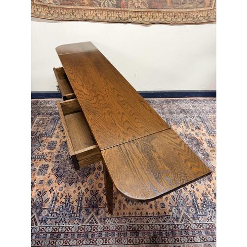 This is an exceptional French rustic farmhouse oak console or side table, beautifully combining traditional country charm...
