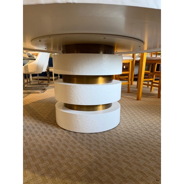 Bring an artistic, sculptural focal point to your dining room or entryway with the "Armand" round dining table from luxury...
