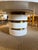 Bring an artistic, sculptural focal point to your dining room or entryway with the "Armand" round dining table from luxury...