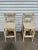 Exceptional set of vintage bohemian bamboo rattan stools. Each feature a woven seat. Sold as a set of 2.
