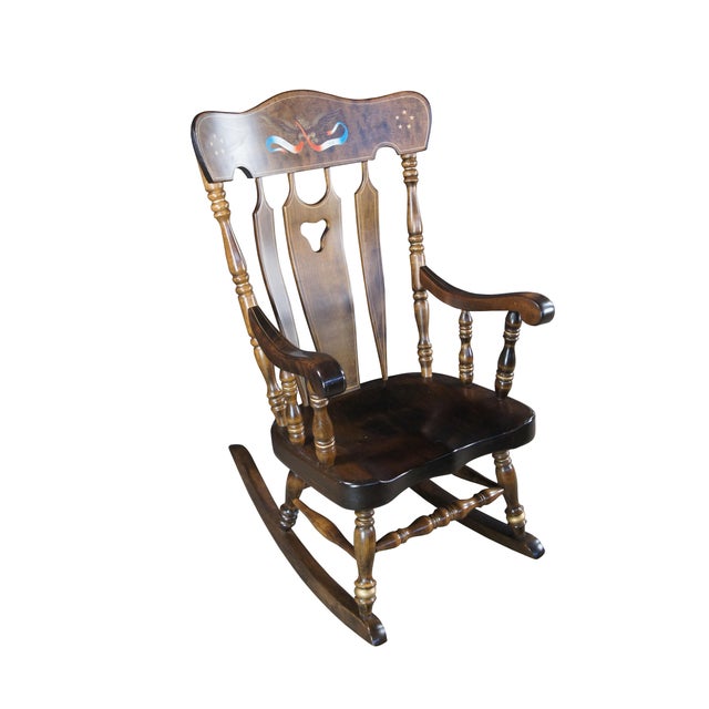 Antique rocking chair by S. Bent & Bros. Made of Maple featuring colonial styling with slatted back and turned posts with...