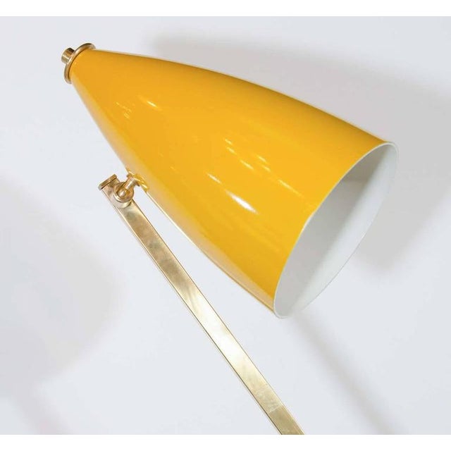 Rare mid-century modern Italian architectural floor lamp. Features asymmetrical frame with geometric arm design in a...