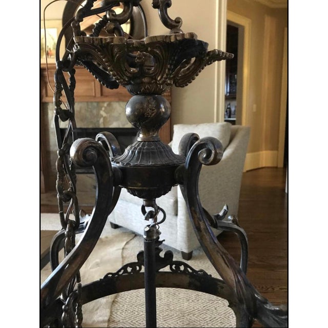 This foyer light stands alone in its class, with old world detail bringing a construction typically found only in antique...
