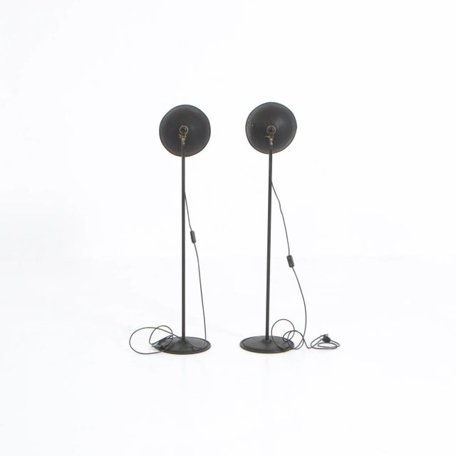 These industrial metal studio lamps were manufactured by Narita in Belgium in the 1950s. The stem is adjustable in height...