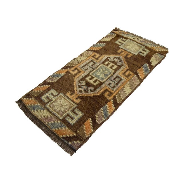 Vintage Handknotted decorative mini rug from Kars region of Turkey. Approximately 45-55 years old. In very good condition.