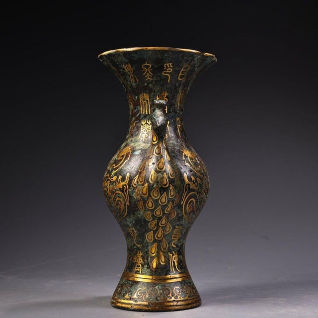 This impressive vessel is crafted in the style of ancient Chinese "Hu" (壶) bronzes. It boasts a beautiful, heavily...