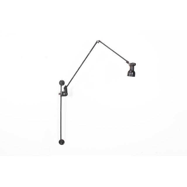 Wall lamp from the Bauhaus period designed by German designer Ernst Rademacher in the 30s All in black metal Signed Height...