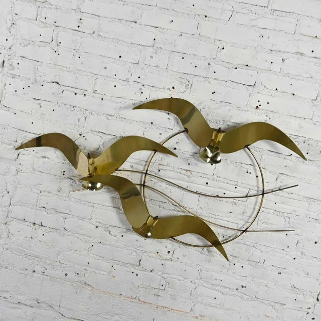Fabulous brass plated bird or flock of seagull’s wall sculpture signed C. Jere, 1985. Beautiful condition, keeping in mind...