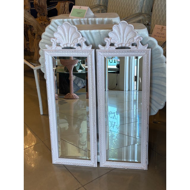 Lovely pair of newly lacquered light pink scalloped shell wall mirrors, beveled mirror. Newly wired to hang. This listing...