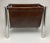 Vintage Mid Century Modern Chrome and Brown Vinyl Magazine Rack. C 1970s. This rack is in wonderful original condition....