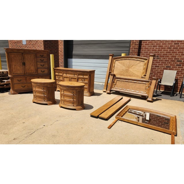 Large complete queen bedroom set in a warm blonde wood finish, offering a cohesive bedroom suite with a light, classic...