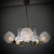 Scandinavian mid-century chandelier, produced by an unidentified Swedish manufacturer in the 1950s. Crafted from brass, it...