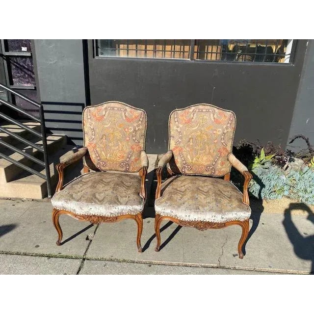 Pair of 19th Century French Walnut Petite Point Neelde Point Arm Chair. Perfect for a traditional style home.
