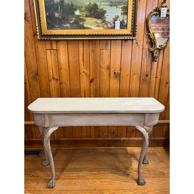 Antique Console Table. Features curved legs with claw-ball-feet and a two-tone distressed finish. Love the painted gold...