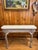 Antique Console Table. Features curved legs with claw-ball-feet and a two-tone distressed finish. Love the painted gold...