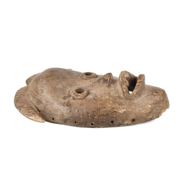 Dan masks, originating from the Dan people of Liberia, CÃ´te d'Ivoire, and Guinea, are recognized for their elongated...