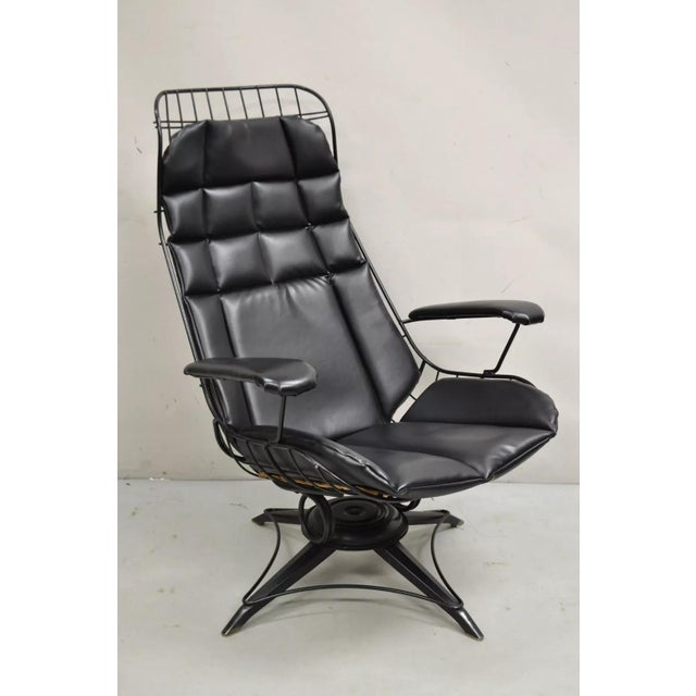 Vintage Mid Century Modern Homecrest Tall Swivel and Tilt Wrought Iron Black Lounge Chair with Black Vinyl Cushion. Circa...