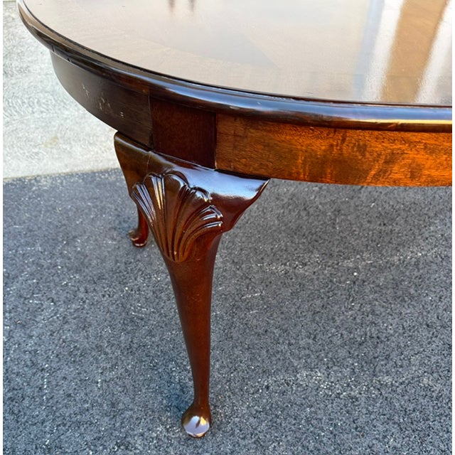 Nice mahogany Queen Anne style dining table with cabriole legs with shell carved knees. The original owner of the table...