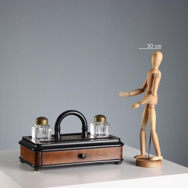 Inkwell with a partially ebonized wooden paper drawer, featuring shaped glass vials and bronze lids. Curved handle and...