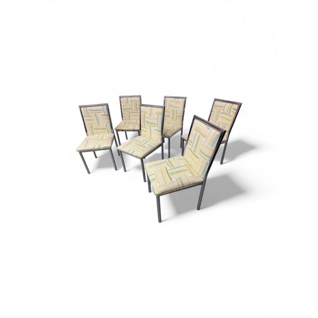 This listing is for a set of six Mid-Century Modern Chrome Dining Chairs. Each chair features a slim chrome frame paired...