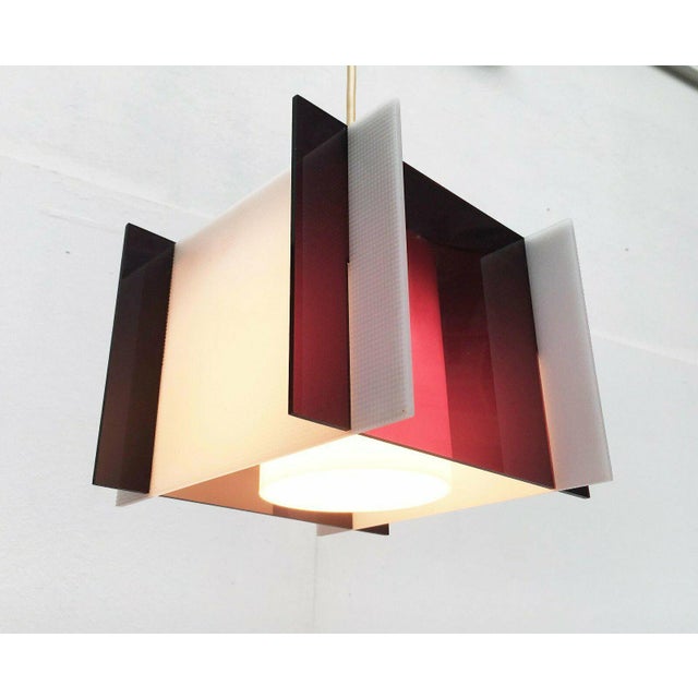 Mid-century pendant lamp made of acrylic glass. The design language is very simple and timeless. The lamp consists of...