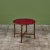 Leather-top occasional table features a deep red leather inset top with floral gold-tooling around the scalloped rim. The...
