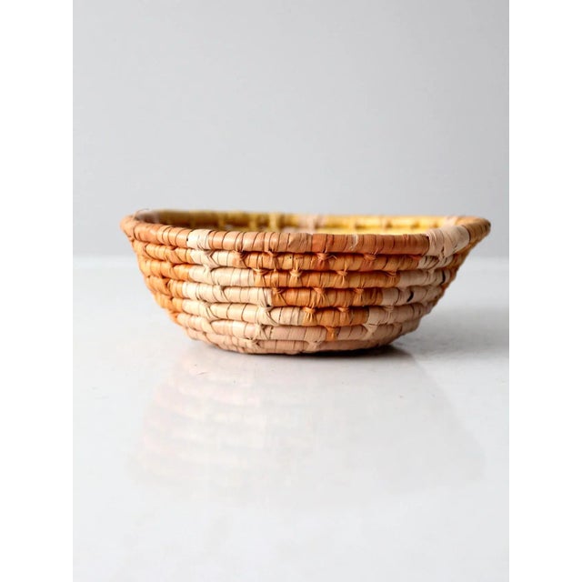 Vintage coiled basket bowl with geometric pattern in sienna beige and yellow tones. Handwoven decorative tribal art basket...