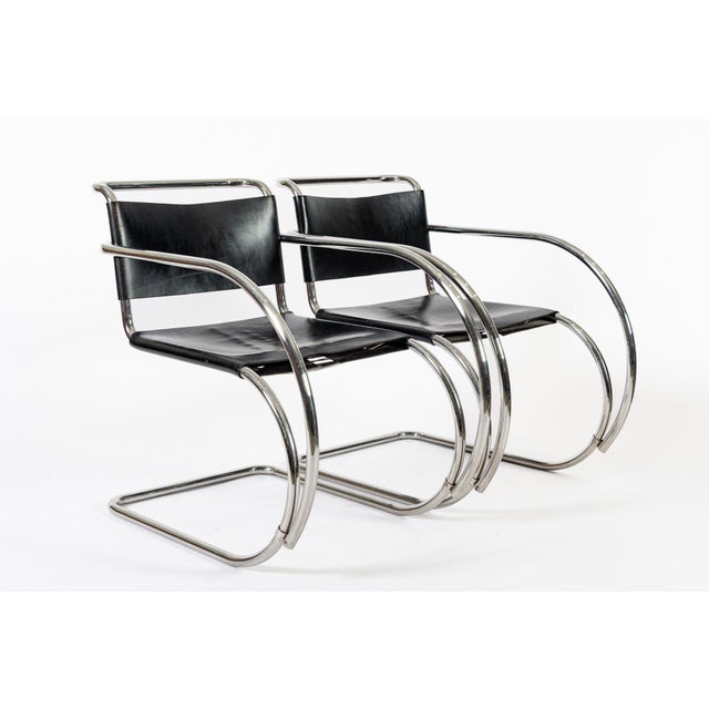 This pair of vintage Bauhaus Mies van der Rohe MR 20 black leather cantilever arm chairs were made by Knoll in 1979. The...