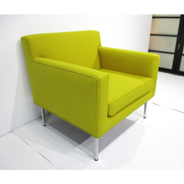 A stunning lemon-yellow upholstered cube lounge chair with stainless steel legs, this piece designed by Janet Rosenblum is...