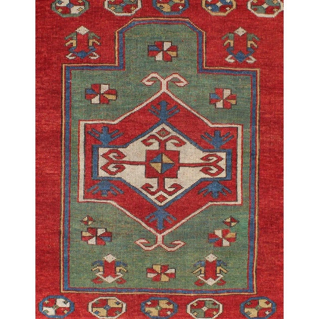 Measures: 3'8 x 4'2. Green Fachralo Kazak, antique Caucasian Kazak rug with Tribal Design in red, blue, green, and ivory....