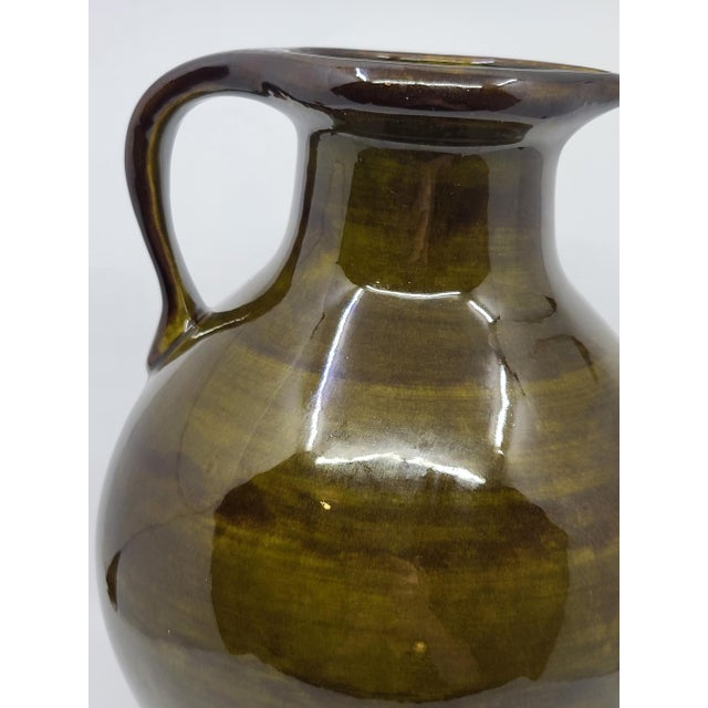 Add a touch of sophisticated French vintage style to your home with this stunning Mid-Century ceramic pitcher vase. Made...