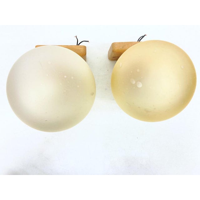 Two wall lamps from the 1970s, single-bulb, E14 socket, by Temde. Oak wood, glass Good used condition with minor signs of...