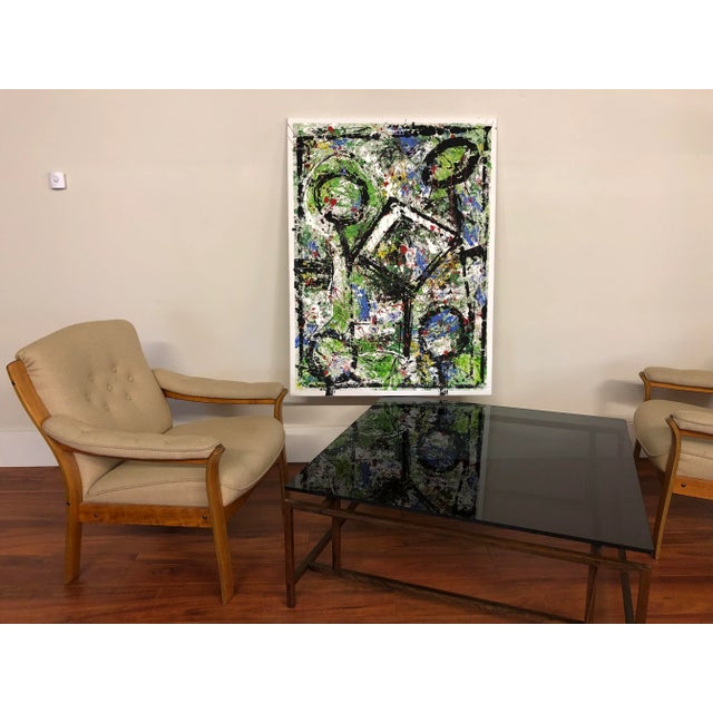 Abstract acrylic on canvas with colors of orange, blue, black white and brown, titled "Mean Lollipops". Painted to be...