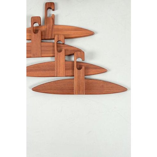 Coat hangers made of beautiful teak wood. This design from the 70s is really stunning and still very modern. In a good...