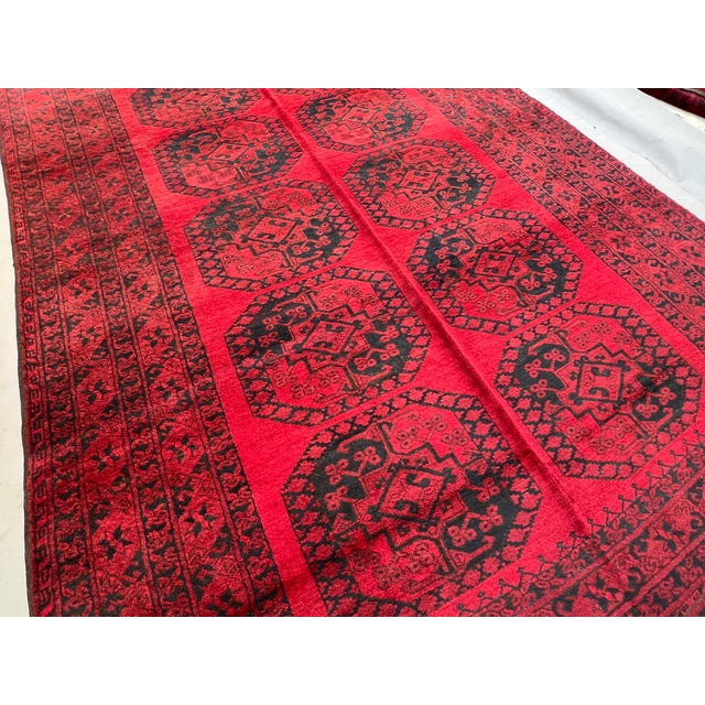 A large vintage Afghan Turkmen Ersari room rug in the iconic "elephant's foot" (Fil-pai) design — two columns of oversized...