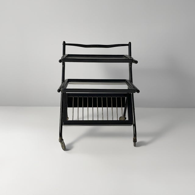 Italian mid-century modern cart by Cesare Lacca, 1950s Drinks cart with a black-painted wooden frame, comprising two...