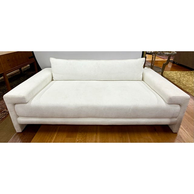 Dressed in soft, durable white chenille, this mid century inspired sofa is as family-friendly as it is chic—perfect for...