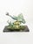 Decorative French sculpture dating from the 1950s, depicting two stylized fish swimming above sculpted waves and rocks....