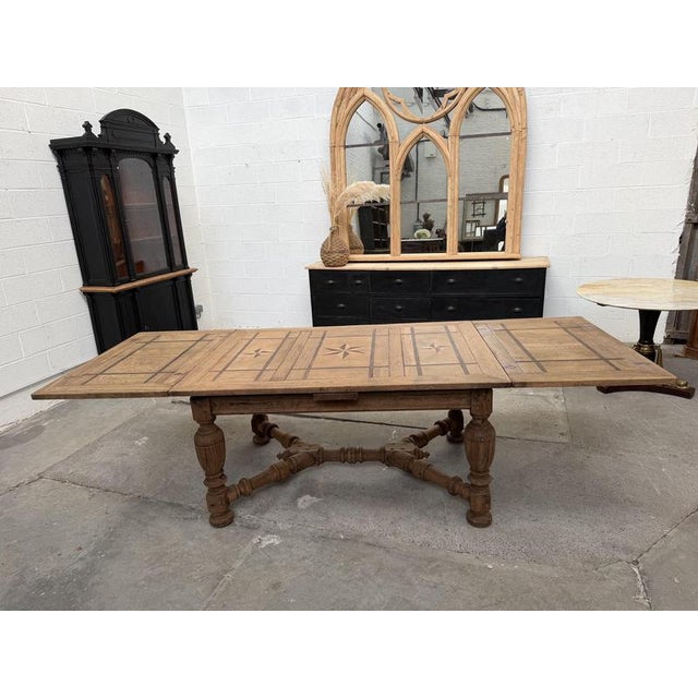 This exceptional 19th-century table has been fully restored. It features a central tabletop measuring 150 cm and two...