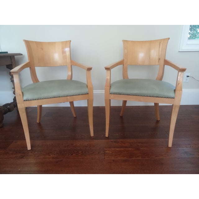 Versatile pair of Biedermeier Chairs upholstered in leather with nailhead trim. We have two pairs available