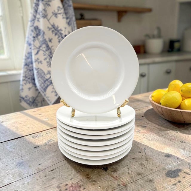 A matched set of nine Apilco Sèvres white porcelain appetizer plates, produced in France and dating to the late twentieth...