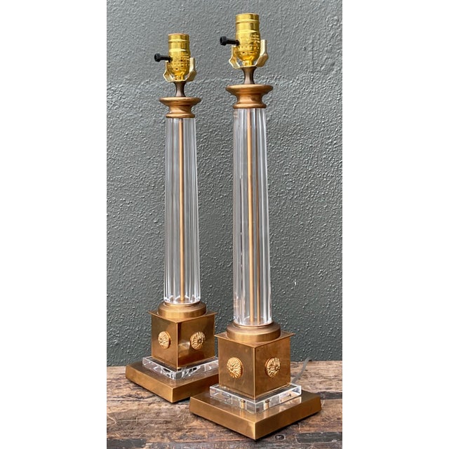 This elegant pair of vintage table lamps is a masterclass in Neoclassical design, blending architectural rigor with the...