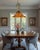 This one‑of‑a‑kind pendant light combines a contemporary handblown art‑glass shade with vintage brass tone components. The...