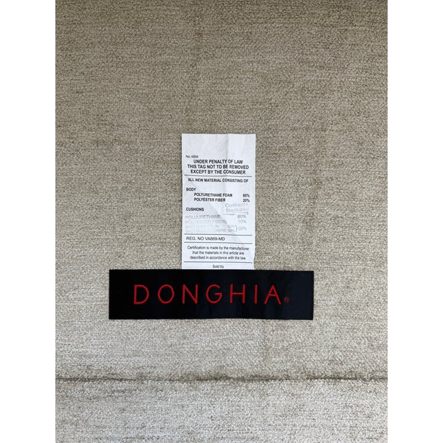 An exceptional Donghia Bond Street daybed, beautifully upholstered in a neutral sage/beige palette that anchors a room...